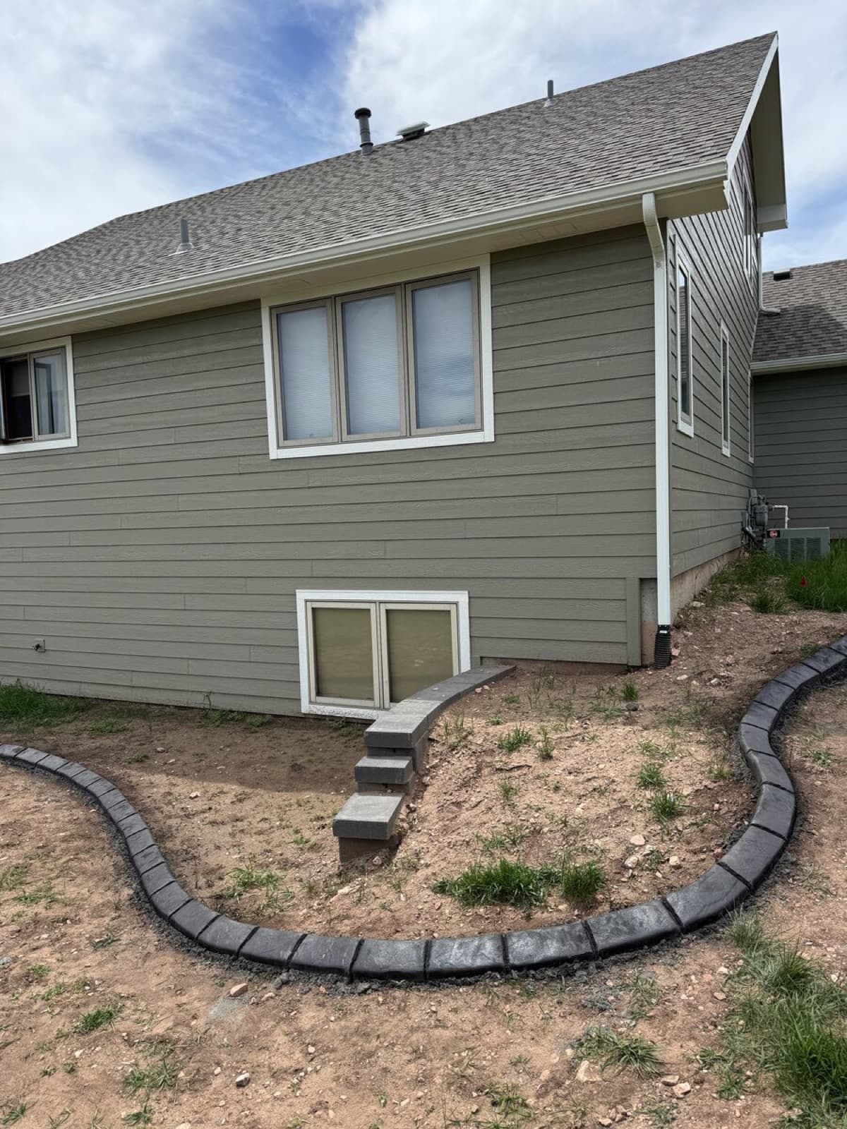 Gravel pathway with decorative rock beds and landscape design