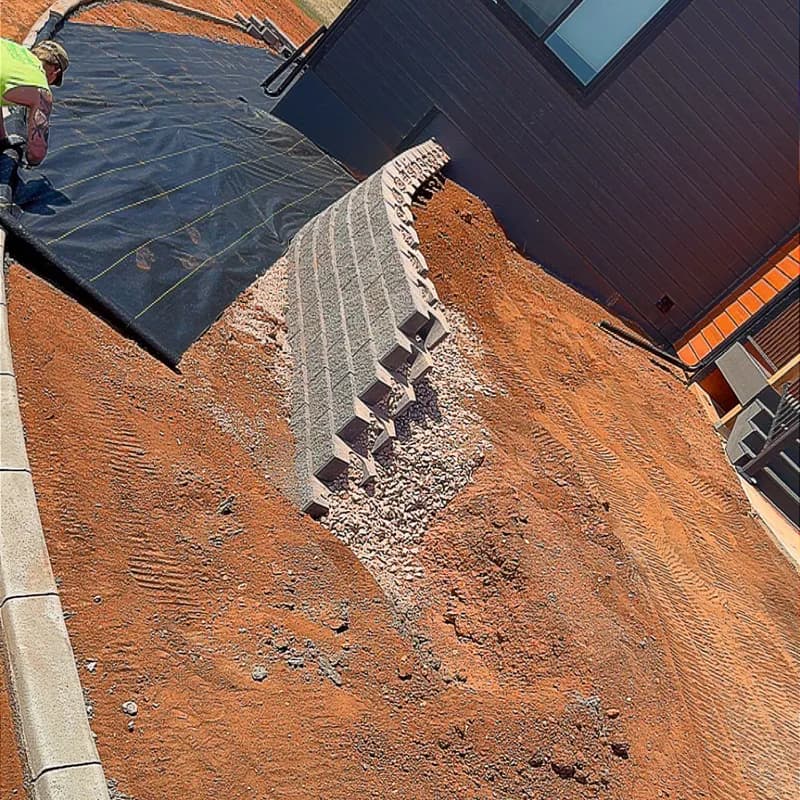 ATK Landscaping erosion control retaining wall construction on Black Hills hillside slope