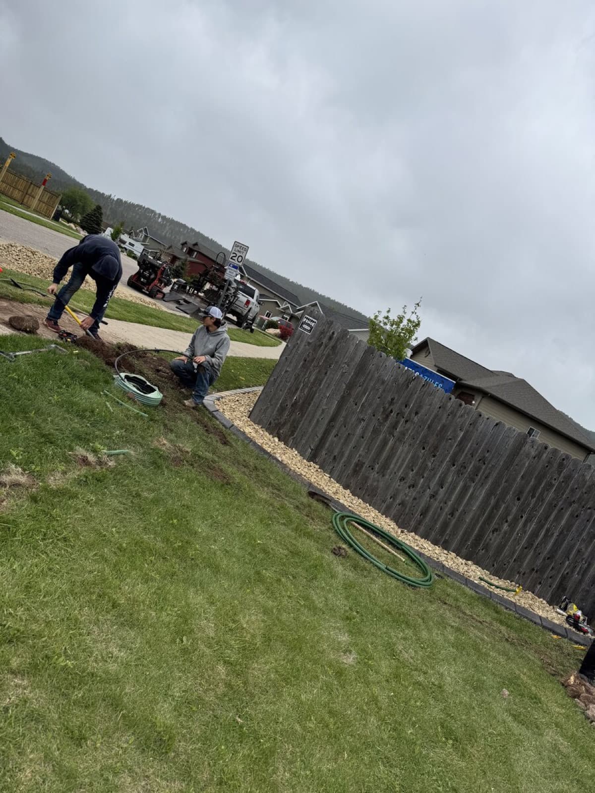 Drainage grading work on a residential property to prevent erosion
