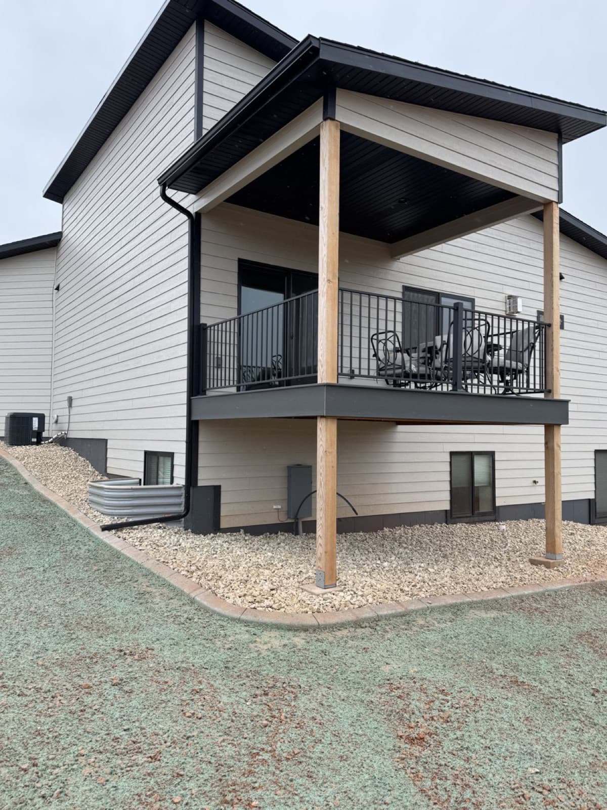 Hardscape installation at a new construction site with grading and wall work