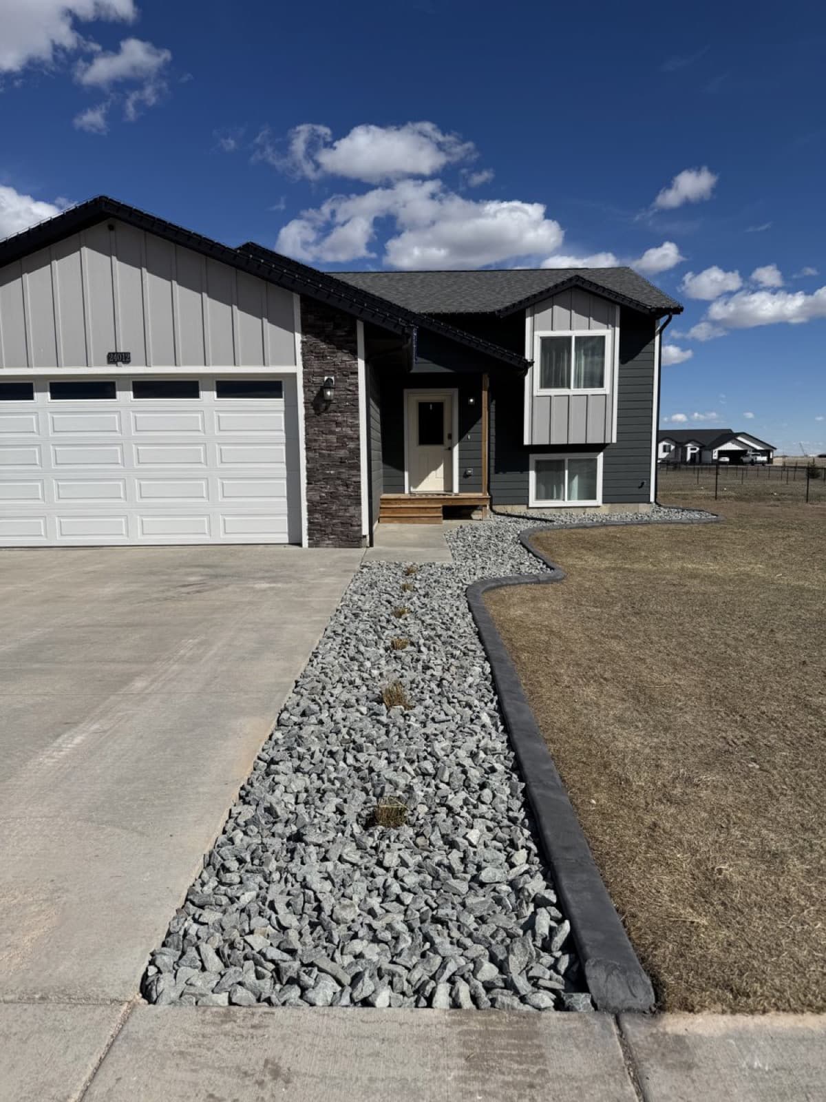 Decorative rock landscaping with clean borders and low-maintenance design