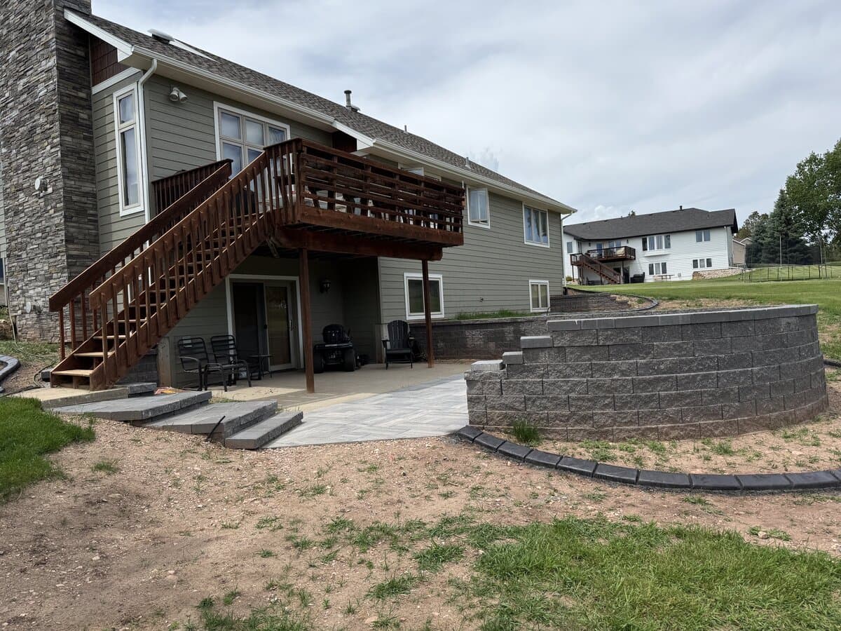 Decorative rock bed design with boulders and gravel in a Rapid City residential yard